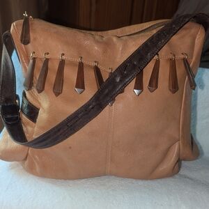 Zina EvaTan Leather Shoulder Bag with Brown Strap And Decorative Accents.